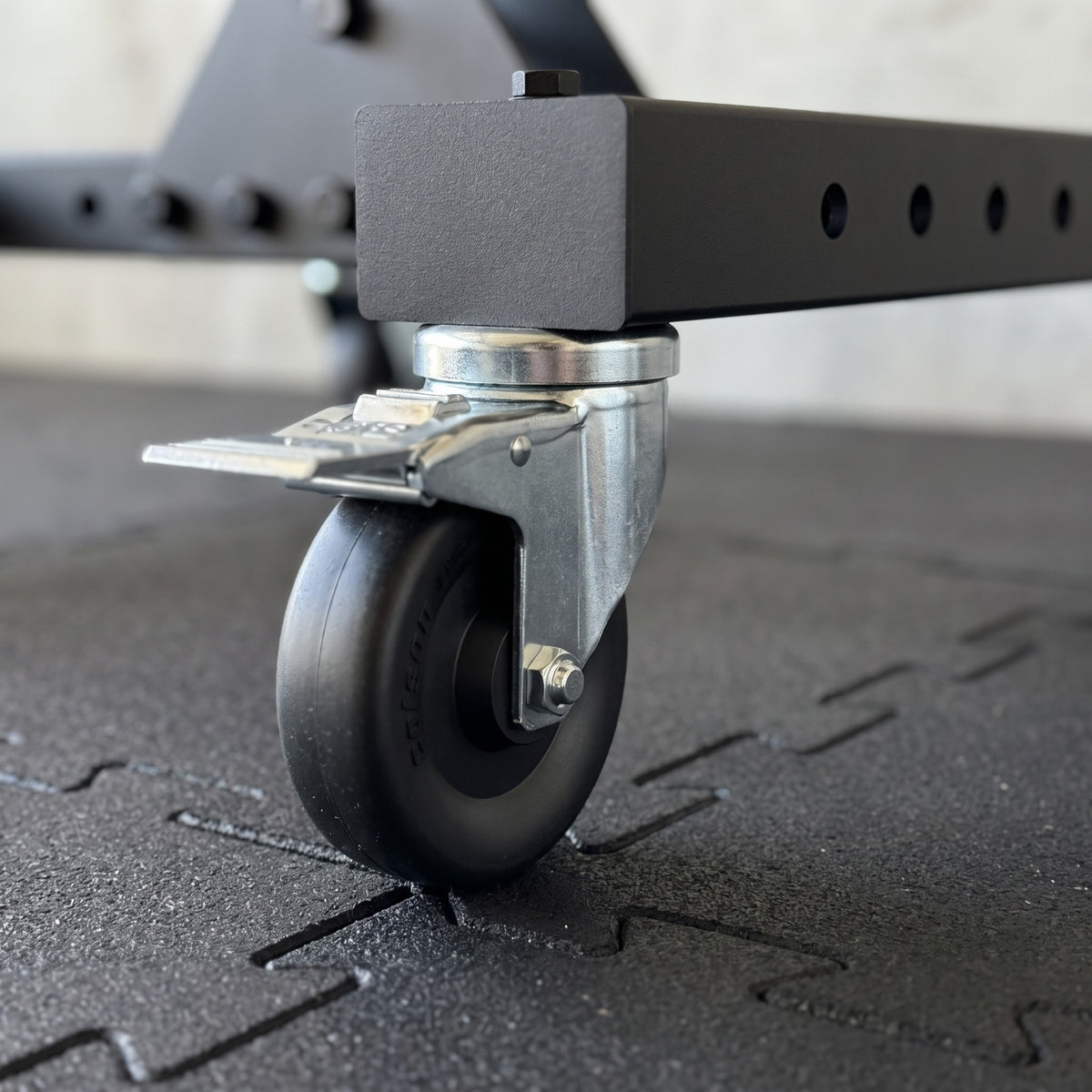 4 inch locking caster bolted under the Delta leg base